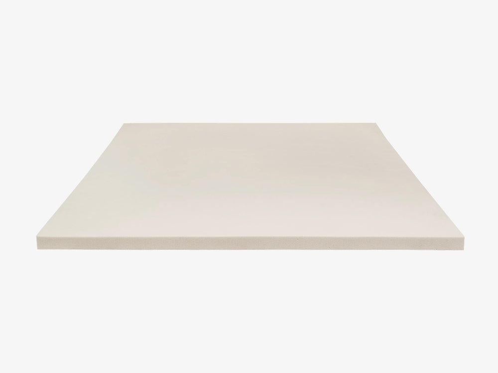 angled view of the 4 lb Memory Foam Mattress Topper foam slab on a neutral background.