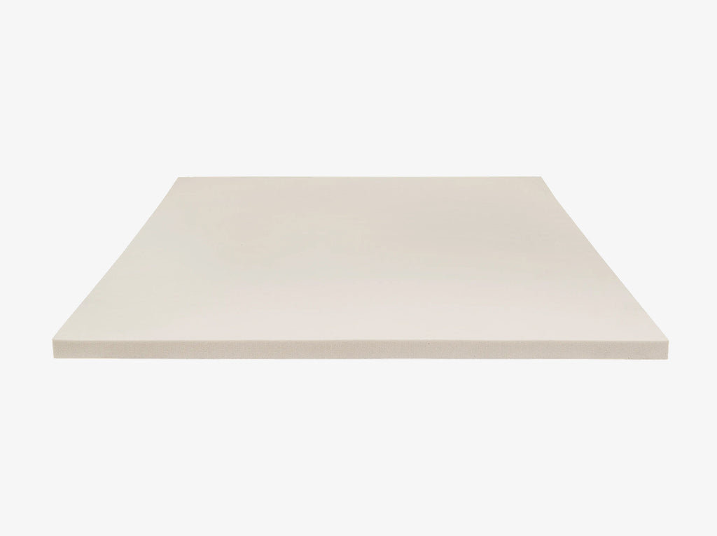 angled view of the 4 lb Memory Foam Mattress Topper foam slab on a neutral background.