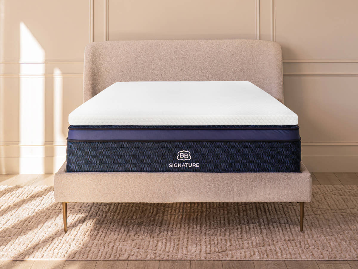 bedroom with  Brooklyn Bedding 4-lb Memory Foam Topper on a mattress