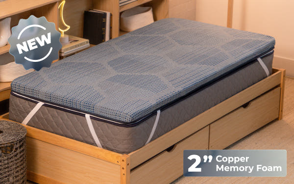 Brooklyn Bedding CopperFlex® 201 Mattress Topper lifestyle scene with woman sitting on the mattress