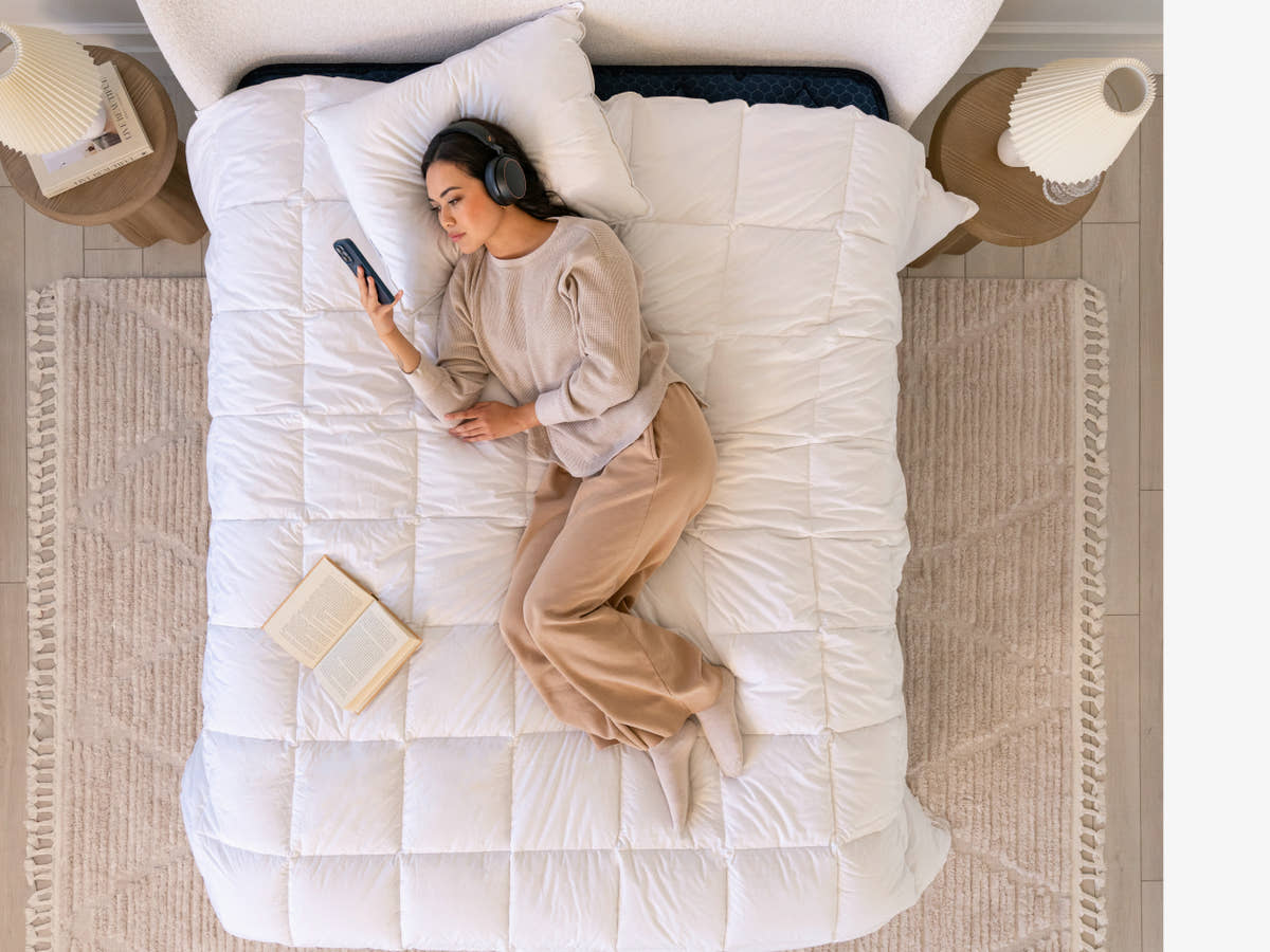 scene with woman laying on bed Brooklyn Bedding All‑Season Alt‑Down Duvet Insert
