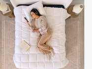 scene with woman laying on bed Brooklyn Bedding All‑Season Alt‑Down Duvet Insert
