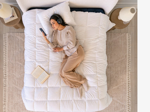 scene with woman laying on bed Brooklyn Bedding All‑Season Alt‑Down Duvet Insert
