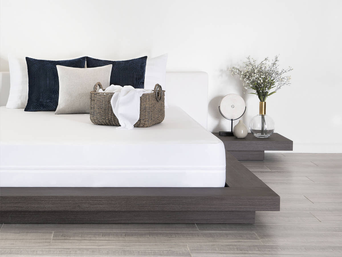Lifestyle bedroom scene of Brooklyn Bedding Mattress Protector on mattress