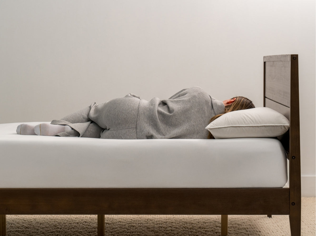 woman laying on Brooklyn Bedding Feather & Down Comfort Pillow