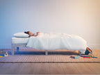 lifestyle bedroom scene of kid sleeping on Brooklyn Bedding Kids Mattress Encasement
