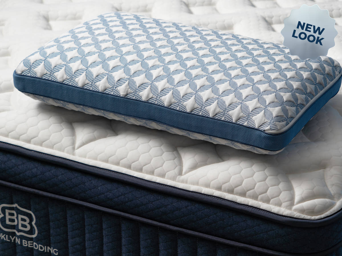Brooklyn Bedding Luxury Cooling Gel Memory Foam Pillow on mattress. badge reads "NEW LOOK"