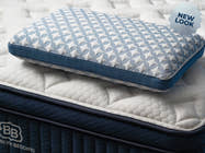 Brooklyn Bedding Luxury Cooling Gel Memory Foam Pillow on mattress. badge reads "NEW LOOK"