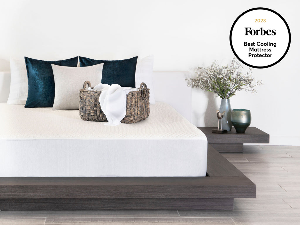 Brooklyn Bedding's Luxury Cooling Mattress Protector in bedroom scene with badge " Forbes best cooling mattress protector"