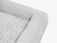 Close-up of the gray plush pet bed surface showing soft textured fabric.