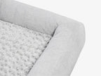 Close-up of the gray plush pet bed surface showing soft textured fabric.