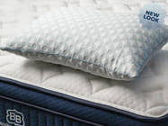 Brooklyn Bedding Premium Shredded Foam Pillow on bed, with badge ' NEW LOOK"