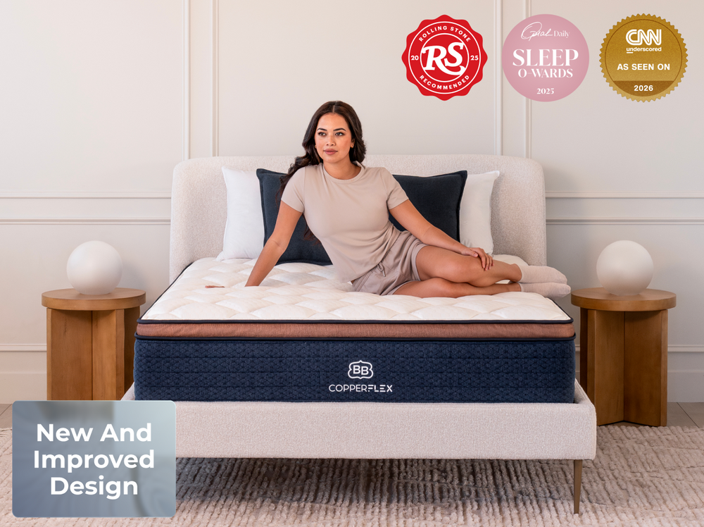 Woman sitting on a mattress with certification logos displayed