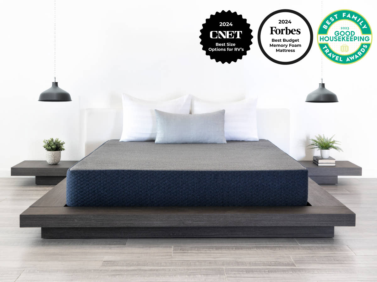 Bedroom scene with  Brooklyn Bedding Dreamfoam Essential Mattress. Badges include "CNET Best size options for RVs" "FOrbes Best Budget Memory Foam Mattress" "Best Family Travel Awards by Good Housekeeping"