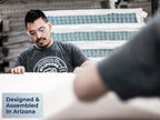 Brooklyn Bedding Plank Firm Mattress being made in a factory, with a badge reading “Designed & Assembled In Arizona.”