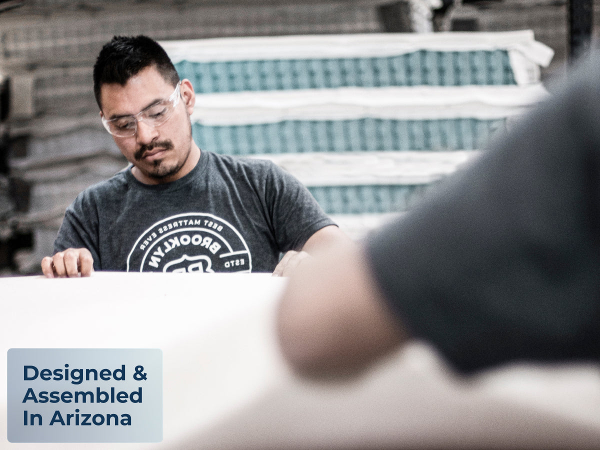 Brooklyn Bedding Plank Firm Luxe mattress being made in a factory, with a badge reading “Designed & Assembled In Arizona.”