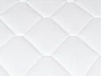Close-up of the Brooklyn Bedding Plank Firm Luxe white quilted surface with large hexagon stitching.