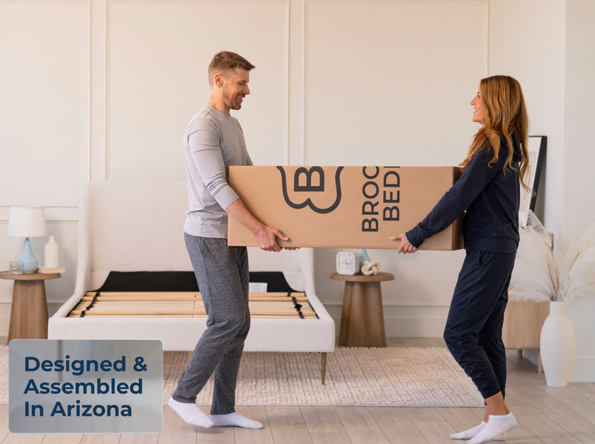 Couple holding Brooklyn Bedding Sedona mattress delivery box