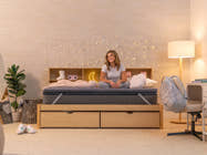 Brooklyn Bedding CopperFlex® 201 Mattress Topper lifestyle scene with woman sitting on the mattress