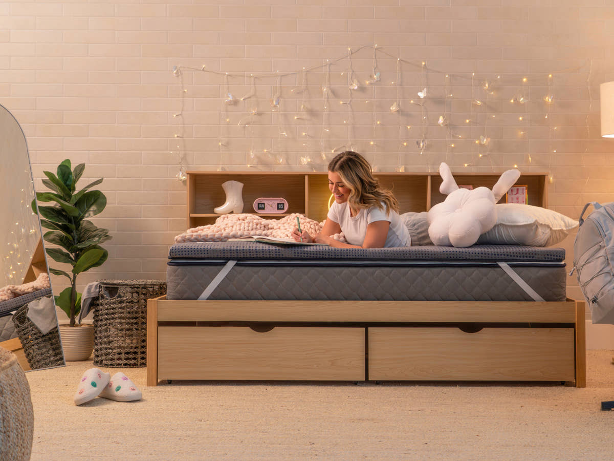 woman laying on Brooklyn Bedding CopperFlex® 201 Mattress Topper in bedroom