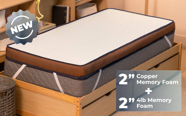 bedroom scene with woman laying on Brooklyn Bedding CopperFlex® 401 Mattress Topper badge says 