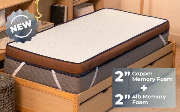 bedroom scene with woman laying on Brooklyn Bedding CopperFlex® 401 Mattress Topper badge says 