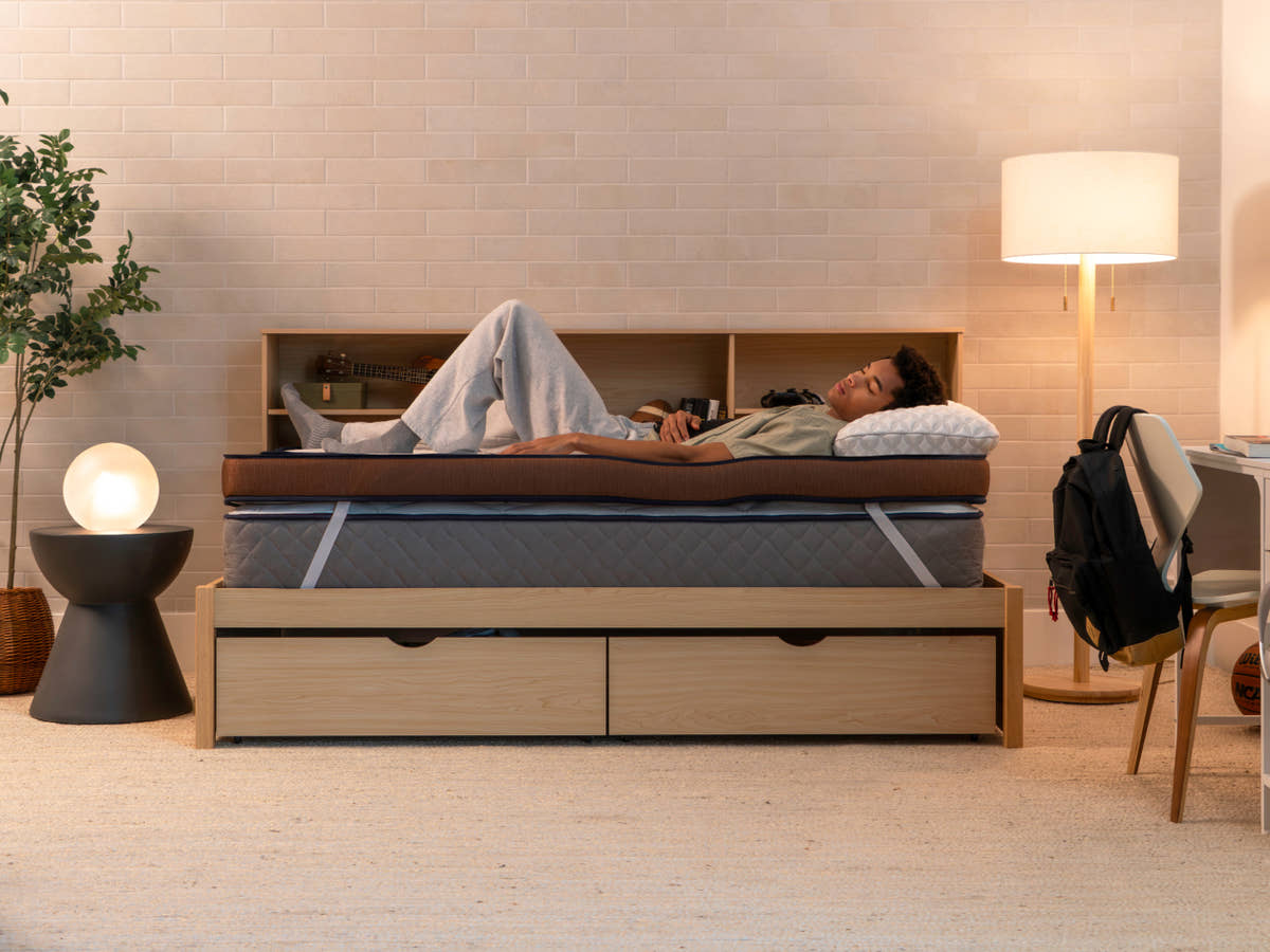 man sleeping on Brooklyn Bedding CopperFlex® 401 Mattress Topper in bedroom