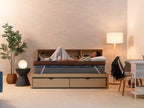 Person resting on the CopperFlex 401 Mattress Topper on a bed in a softly lit bedroom.”