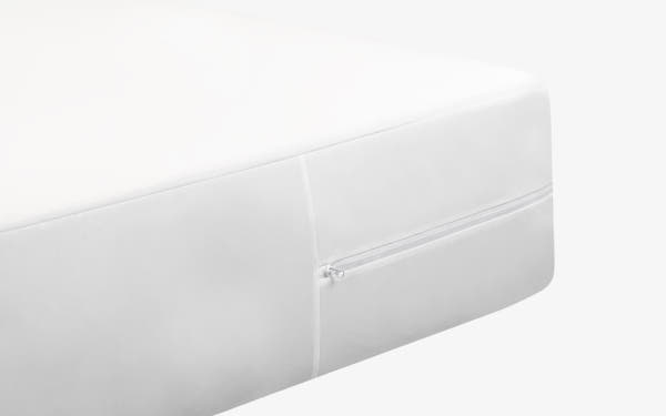 Lifestyle bedroom scene of Brooklyn Bedding Mattress Protector on mattress