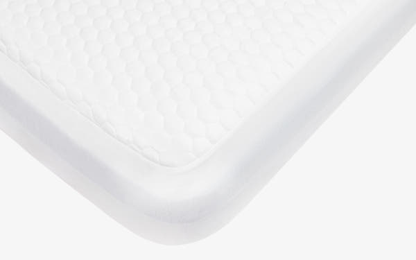 Brooklyn Bedding's Luxury Cooling Mattress Protector in bedroom scene with badge 