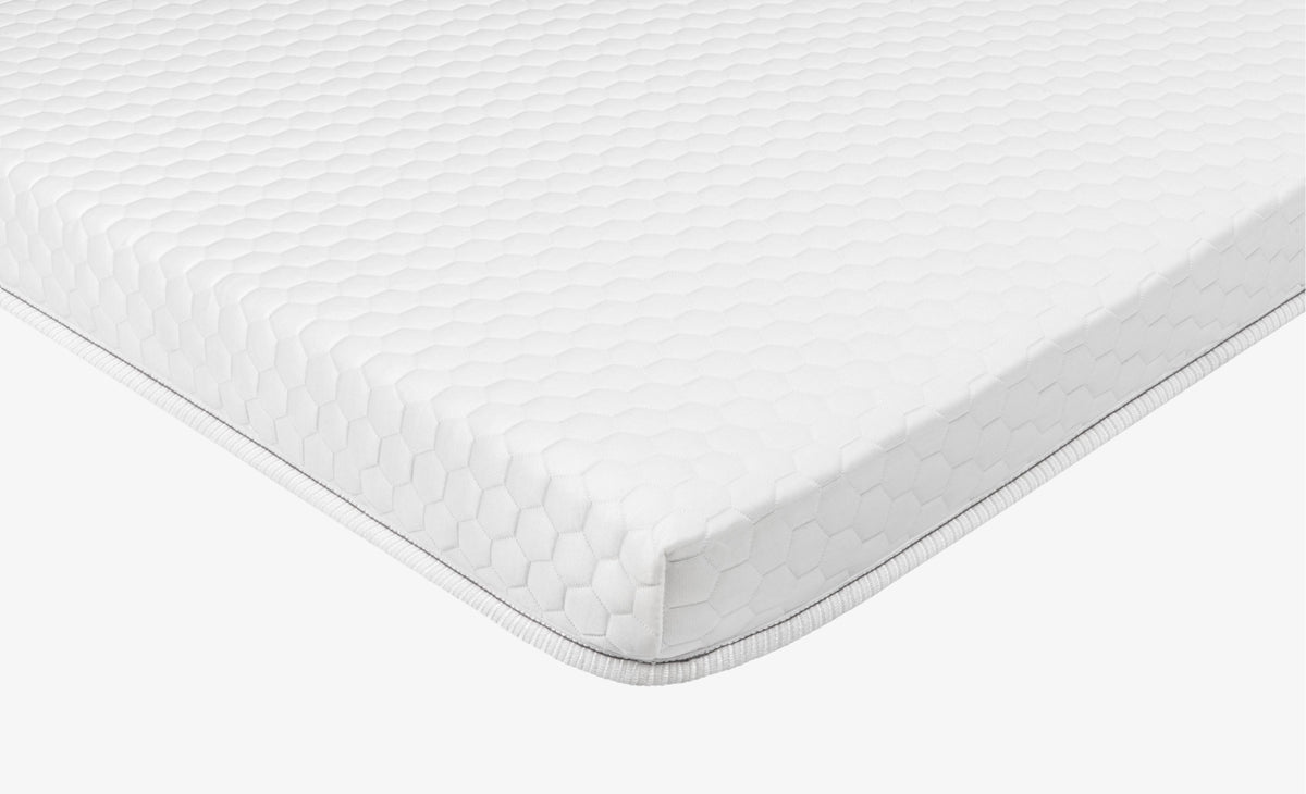 Corner shot of  Brooklyn Bedding Microcoil Mattress Topper
