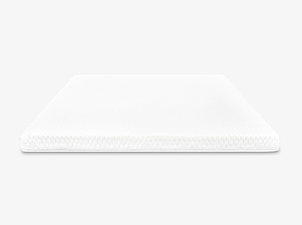 Front view of a white mattress topper with hexagon quilted cover on a neutral background.