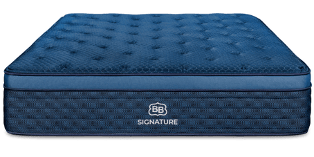 Brooklyn Bedding Signature Hybrid mattress on a cream upholstered bed in a bright bedroom with award badges reading “Our Pick Wirecutter 2025,” “Best of Forbes Vetted 2024,” and “Best of CNET 2025,” plus a “New And Improved Design” callout.