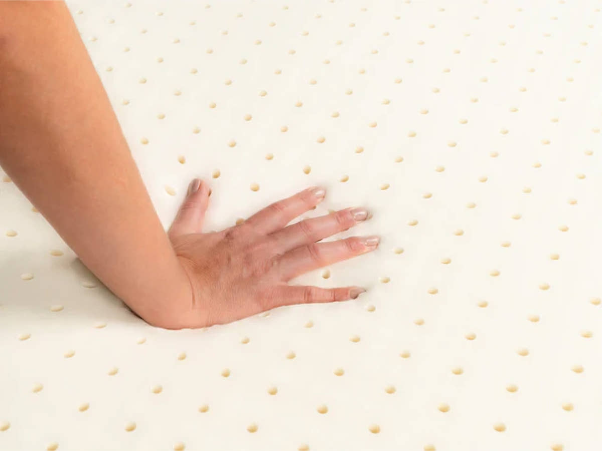 hand press of  Brooklyn Bedding 3” Latex Topper