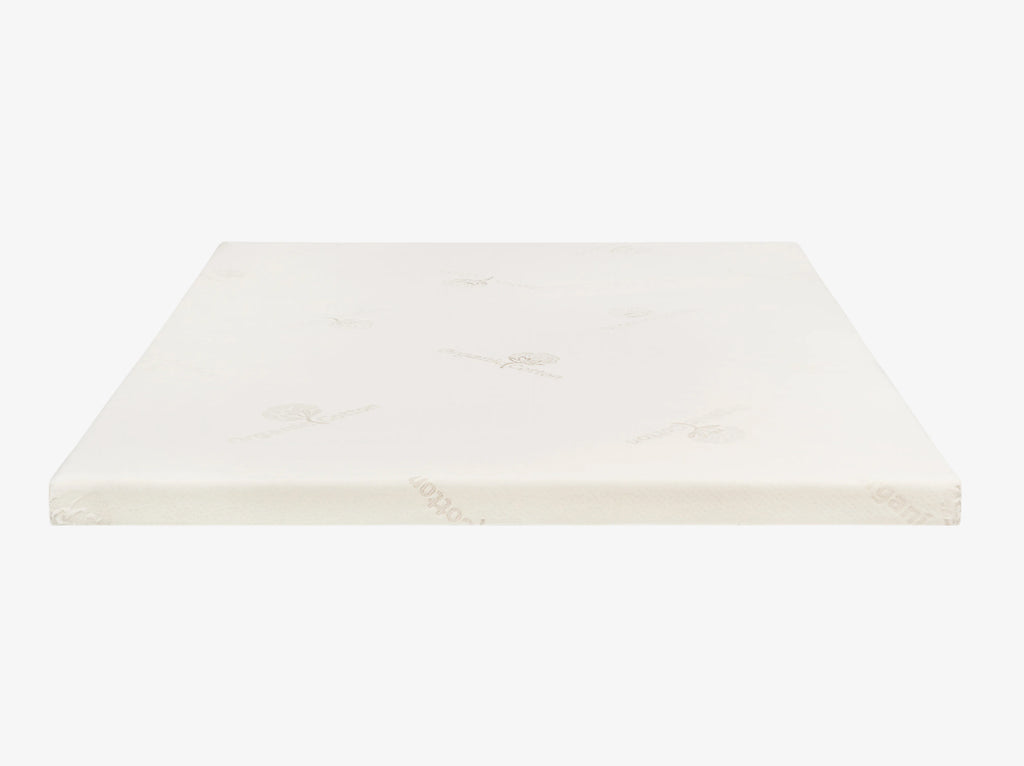 Talalay latex mattress topper encased in an organic cotton cover on a neutral background.