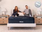 Brooklyn Bedding ThermoBalance Mattress with two people sitting on the bed, with a badge reading “NEW.”