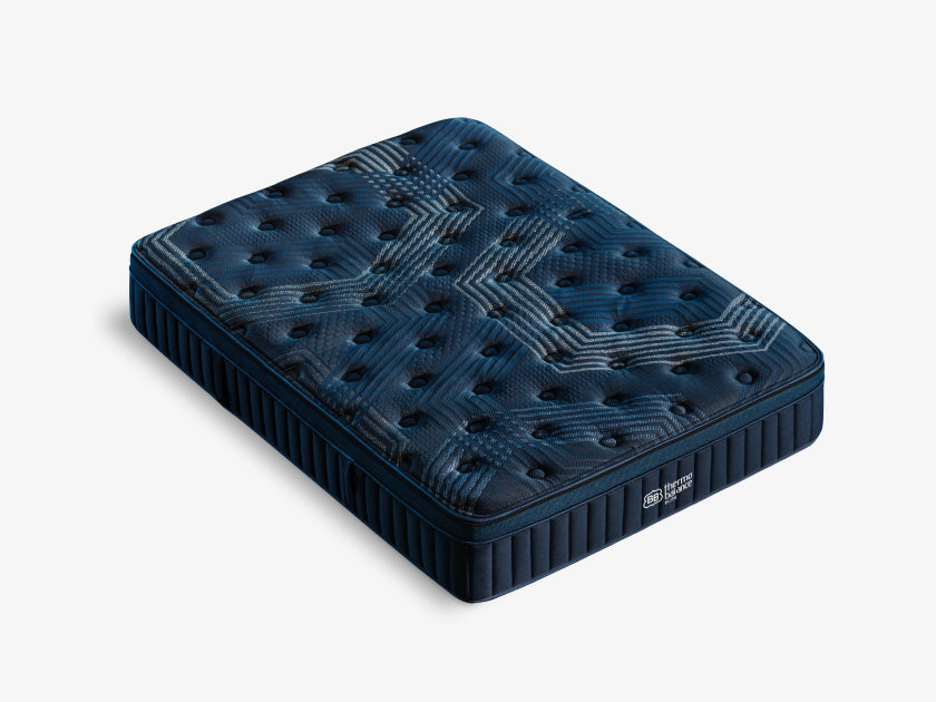 Angled top-down view of the mattress highlighting the geometric pattern of its quilted stitching.