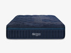 Straight-on front view of the navy blue ThermoBalance Elite mattress showing the logo and ribbed side panels.